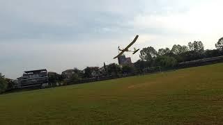 RC POWERED GLIDER FLYING HIGH IN THE SKY