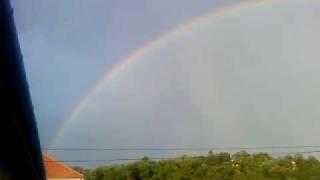 big rainbow above the city