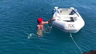 Entering a dingy from the water, using a home made ladder.