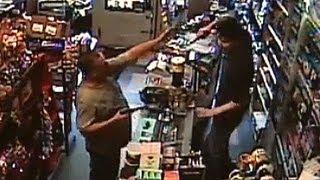 Armed robber meets his match - CCTV