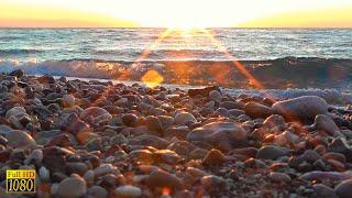 BEAUTIFUL SUNRISE OVER THE SEA. Morning waves