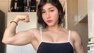 Teen muscle girl flexing biceps