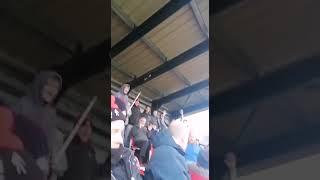 Fans help get a ball back in Non League action. Kettering Town FC