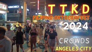 Nighttime on MacArthur Oktoberfest Crowds Out to Celebrate in Angeles city.