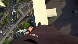 Parkour Runner Misses Jump And Falls Off High Rise Roof, Catches Himself On Electric Wires