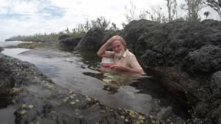 Ian Argus Stuart having a bath with a 'snake' inside on Devil's Island