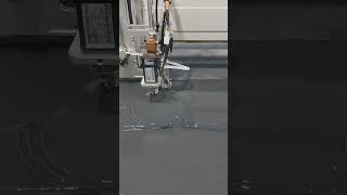 This fully automatic machine is applying glue.
