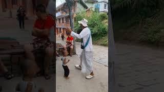 A small child dancing in Harinām Sankirtan at Bhaktapur.