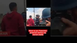 Pro-Palestinian protester berates CNN for biased reporting of the war