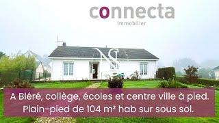 A pied du centre ville de Bléré, cette maison sur sous-sol semi enterré propose 105 m² hab