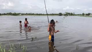 Philippines : Simple life in the province. Flood. Fishing. Swimming