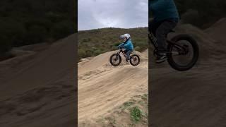 Jumping bikes and racing storm runoff  #kidsbike #playoutside #rainyday