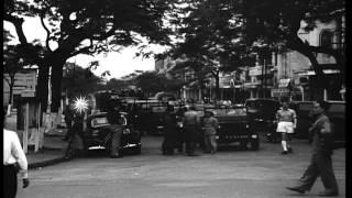Communist trucks carrying troops wait to occupy Haiphong, Vietnam. HD Stock Footage