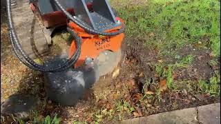 Klou KSG1-EX stump grinder attachment on Ditch Witch skid steer.