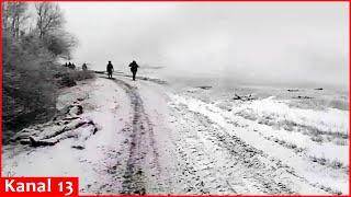 Footage of scores of North Korean and Russian soldiers frozen in the snow in Kursk