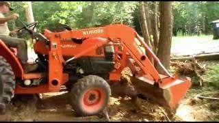 culvert pipe cleaning with the Kubota tractor.