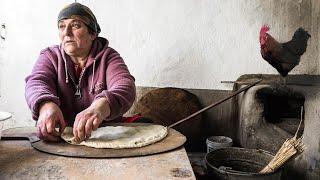 Traditional Lezgi dishes in an old Street Oven. Life in Dagestan village. Russia