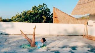 yoga practice : vinyasa on rooftop as the sun goes down in Bali