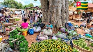 Rural village market day in Abobo Togo west Africa . Buying and cooking traditional Togolese ademe