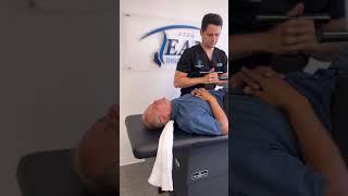 Dr. Ali Elahi administers the Ring Dinger ® on local Dallas man, low back and neck pain are gone