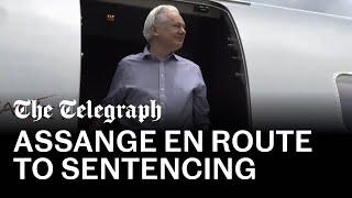 Julian Assange en route to US sentencing in Mariana Islands
