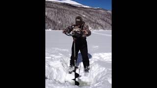 Colorado ice fishing - drilling hole in thick ice