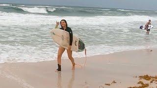 Surfing and Stripping Wax Off a Surfboard. Surfing Fort Walton Beach Destin Gulf Coast Florida Drone