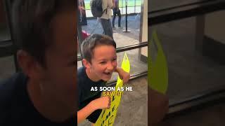 Son greets dad with a surprising sign 