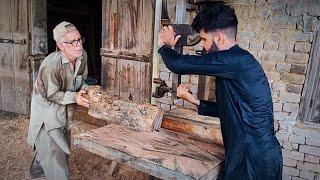 Elderly man sawing scratch wood to makes charpoy legs on ara machine | Awan Wood Works