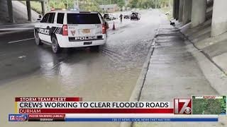 Durham crews worked to clear flooded roads Friday