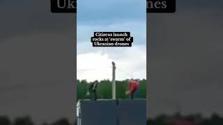 Citizens launch rocks at 'swarm' of Ukrainian drones