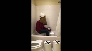 Man-horse plays "Africa" by Toto on a bucket in a shower