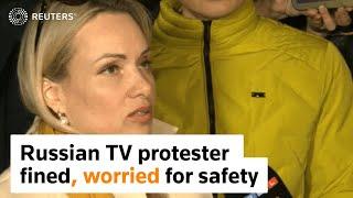 Russian TV protester fined, worried for safety