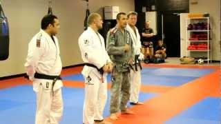 Jeffrey Jacob and Scott Clarke receive their Black Belt