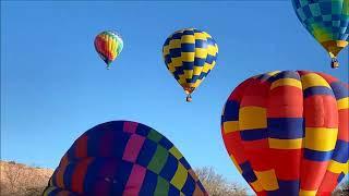 Hot Air Balloons at 4X Speed as they Float Across the Red Rocks