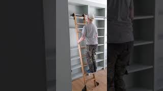 Custom woodworking; custom library with white oak rolling ladder