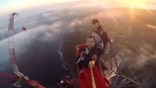 Daredevils climb crane, take selfie nearly 1,200 feet up