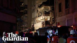 Emergency workers attend building after airstrikes hit central Beirut