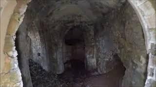 roman bath ruins and sandstone cave tunnel