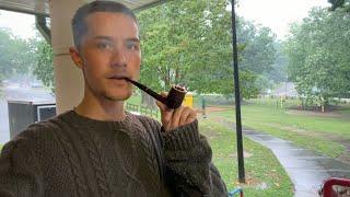 Smoking Pipe Under a Metal Roof on a Rainy Day