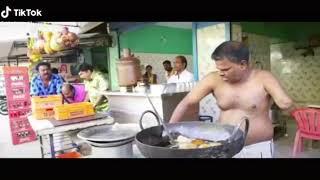 man cooking food with one hand