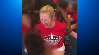 Cheerleader violently forced to do splits