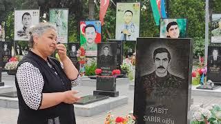 Bir məzarın başında-1994 cü il yanvar şəhidləri və digər şəhidlər Elman Əliyev və Ülvi Qulamlı
