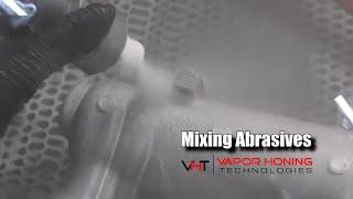 Vapor honing can mix abrasives - Vapor Honing Technologies