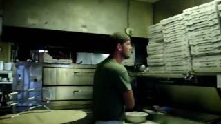 Joe flipping pizza