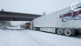 Heavy snow strands truck drivers in Northern California