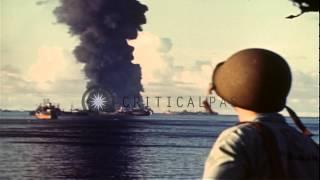 Black smoke and flame rises from USS Mississinewa as it is hit by a Kaiten Kamika...HD Stock Footage