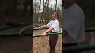 Woman is determined to do a handstand on the parallel bars!