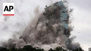 A hurricane-damaged skyscraper is imploded in Louisiana