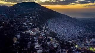 Night & day look at Montagne Noire, Morne Calvaire & Petion-Ville